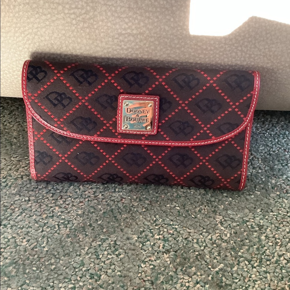 Dooney & Bourke black and red flap wallet.  Excellent condition.